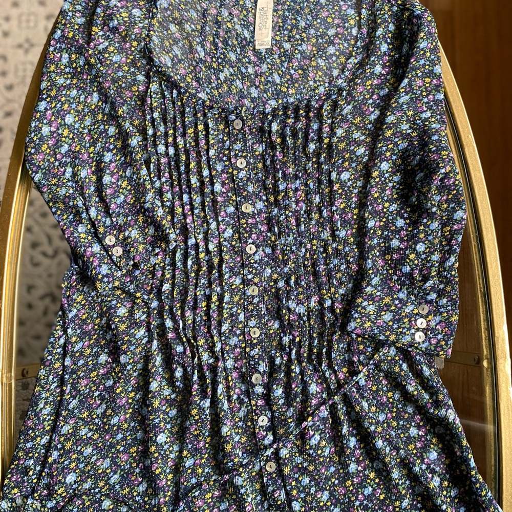 Floral button down blouse with tie waist and button sleeve. Spring top